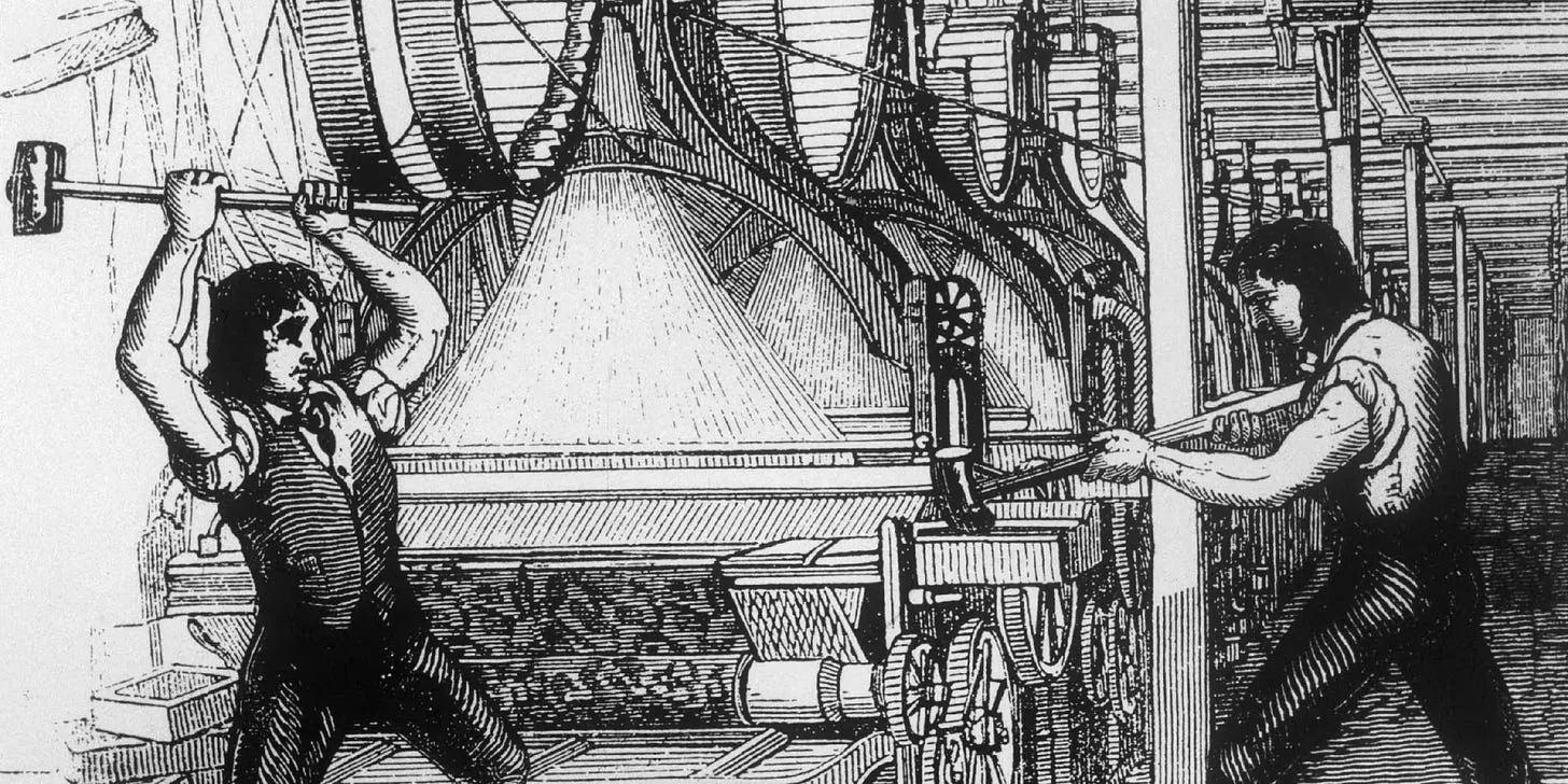 Luddites smashing an industrial loom